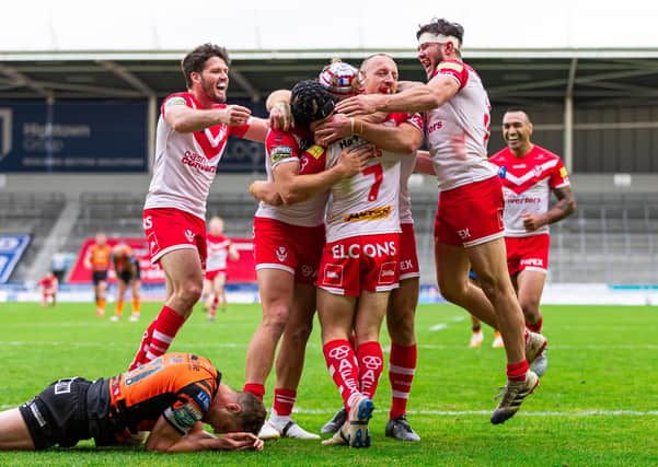 St Helens' Theo Fages celebrates his try with team-mates.