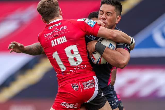 Hull FC's Andre Savelio is tackled by Salford's Chris Atkin in last week's game (Picture: SWPix.com)