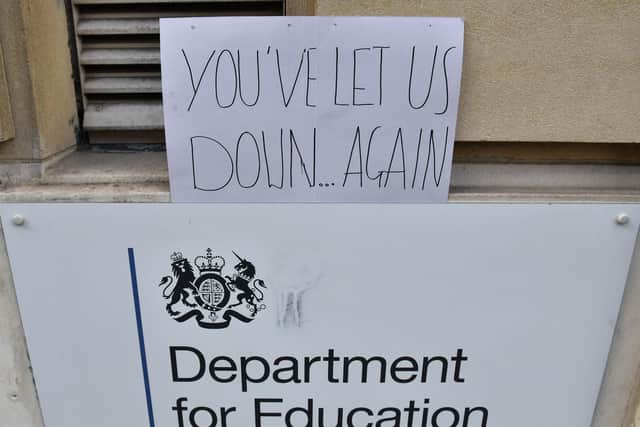 A sign left outside the Department for Education building in London, as a protest over the continuing issues of last week's A level results