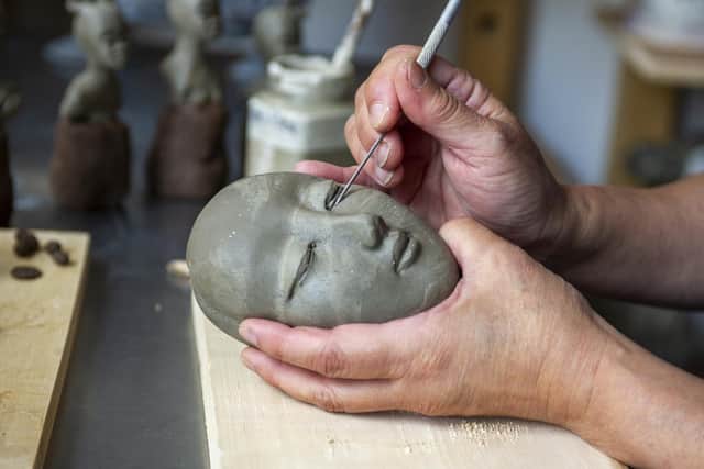 Ceramicist Jenny Chan is making NHS frontline workers from modelling clay at the Yorkshire Artspace, Sheffield Picture: Tony Johnson