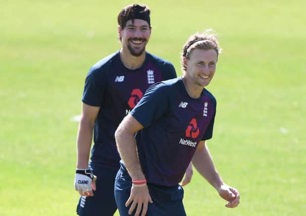 Rory Burns and Joe Root of England share a joke during a fielding drill. (Photo by Stu Forster/Getty Images for ECB)