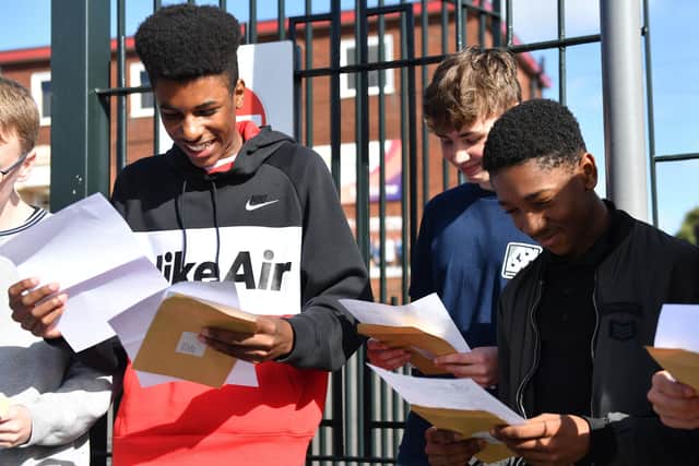 Students react after openinig their GCSE results.