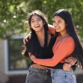 Twins Esha (left) and Risha Gupta  get their GCSE results at The Grammar School at Leeds. Picture: PA/Danny Lawson.