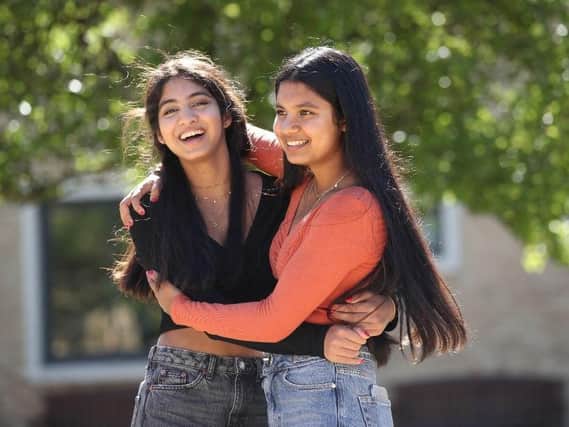 Twins Esha (left) and Risha Gupta  get their GCSE results at The Grammar School at Leeds. Picture: PA/Danny Lawson.