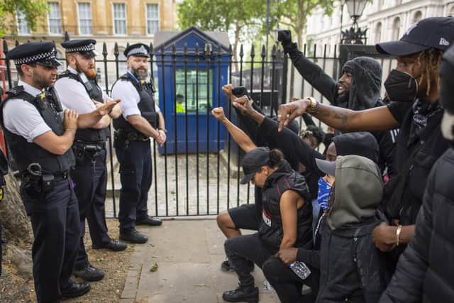 Police and protesters at a Black Lives Matter demonstration in London, as a survey shows 65% of BAME people feel there is bias against them within police forces
