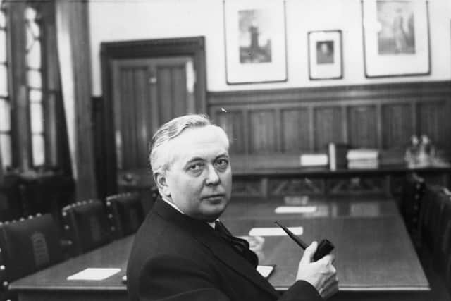 25th February 1963:  Harold Wilson, then newly appointed leader of the opposition, sits with his pipe in hand at the House of Commons in the room where the shadow cabinet meets.  (Photo by Central Press/Getty Images)