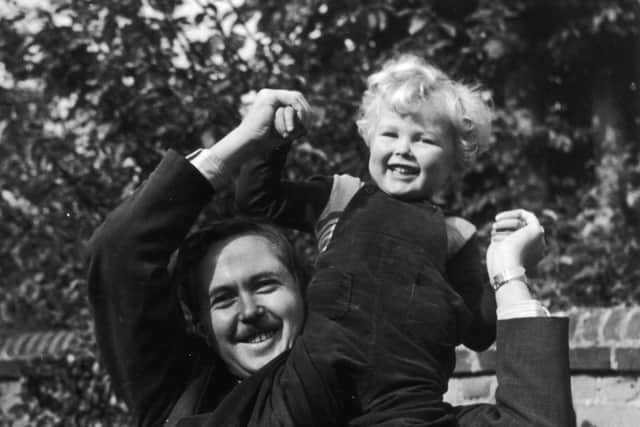 22nd October 1947:  British Labour politician and future Prime Minister Harold Wilson playing with his three-year-old son Robin.  (Photo by Chris Ware/Keystone Features/Getty Images)