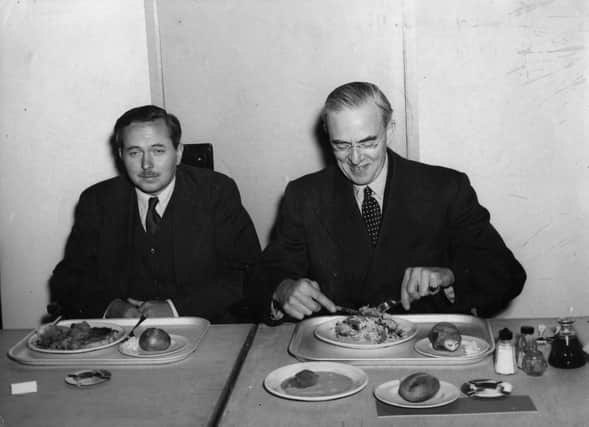 British Labour politician Harold Wilson, newly appointed President of the Board of Trade, with Sir Stafford Cripps, former President of the Board of Trade, newly appointed Minister for Economic Affairs, at the opening of the staff canteen at the Board of Trade.  Original Publication: People Disc - HL0252   (Photo by Edward G Malindine/Getty Images)