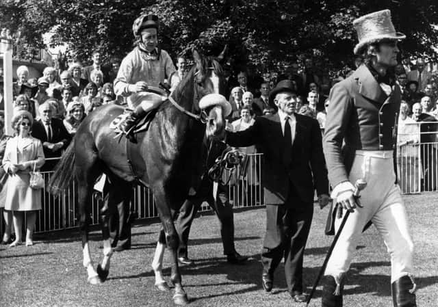 12th September 1972:  Jockey F Burr on racehorse 'Crazy Rhythm' is led in after victory in the Ebor Handicap at York.  (Photo by Evening Standard/Getty Images)