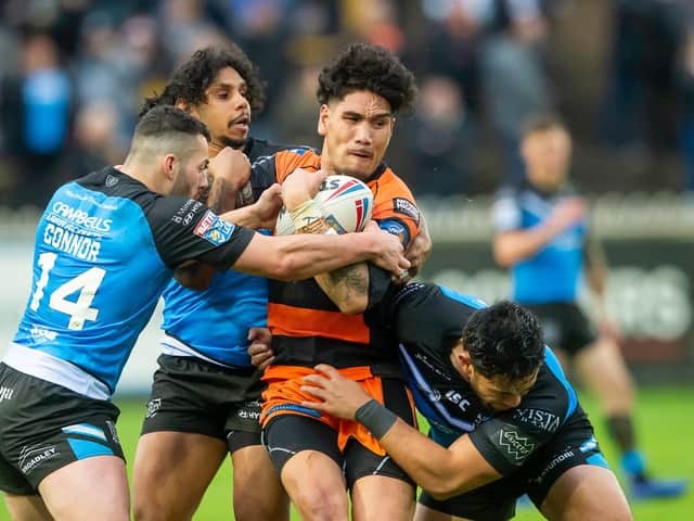 Castleford's Jesse Sene-Lefao Is tackled by Hull FC's Jake Connor, Albert Kelly and Andre Savelio. (Allan McKenzie/SWpix.com)