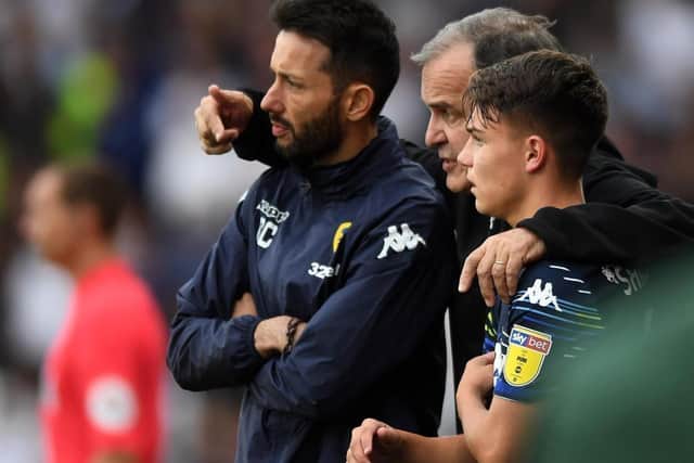 Carlos Corberan and Marcelo Bielsa working together at Leeds (Picture: Jonathan Gawthorpe)