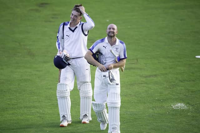Yorkshire's Adam Lyth, right, leaves the field with George Hill after finishing the day's play against Lancashire on 86 not out. Picture by Allan McKenzie/SWpix.com