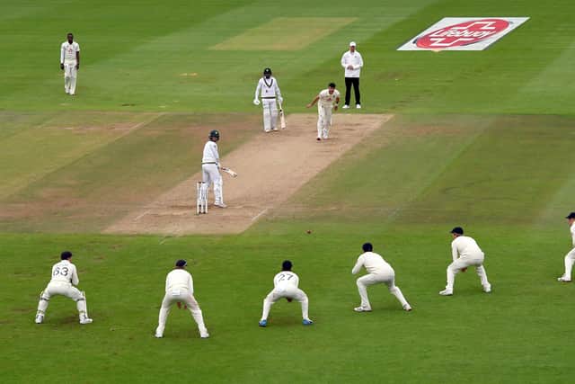 England's James Anderson looks on as Dom Sibley drops a catch in the slips. Picture: Mike Hewitt/NMC Pool/PA