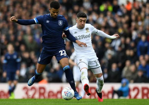 Leeds United's Pablo Hernandez takes on Huddersfield Town's Fraizer Campbell. Picture Jonathan Gawthorpe