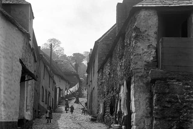 A steeply sloping cobbled village street - location unknown