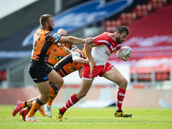 Alex Walmsley of St Helens is tackled by Mike McMeeken of Castleford in the 10-0 Super League win. (Isabel Pearce/SWpix.com)