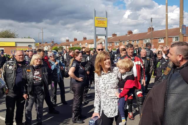 Jayden Walters,4, who has a rare condition, being held by his mother, Sarah Jayne Walters (centre), had his birthday wish granted when local bikers sang him happy birthday.