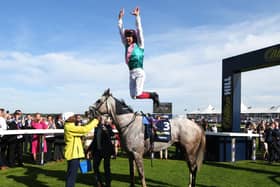 TIMELY BOOST: Jockey Frankie Dettori performs his traditional celebratory leap after winning last year’s St Leger at Doncaster on Logician. Picture: George Wood/Getty Images.