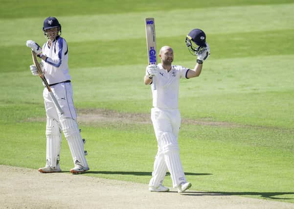Century: Yorkshire's George Hill looks on as Adam Lyth celebrates his century against Lancashire in the Bob Willis Trophy. Picture: SWPix
