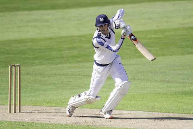 Roses knock: Yorkshire's George Hill hits out against Lancashire.