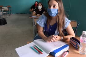 Pupils in a Tunisian high school students wearing face masks. But Yorkshire health and education chiefs want clarification on wearing them in schools in England. Photo credit: FETHI BELAID/Getty Images.