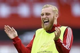 IMPROVEMENT: Sheffield United's Oliver McBurnie has a joke during warm up at Bramall Lane. Picture: Peter Powell/NMC Pool/PA