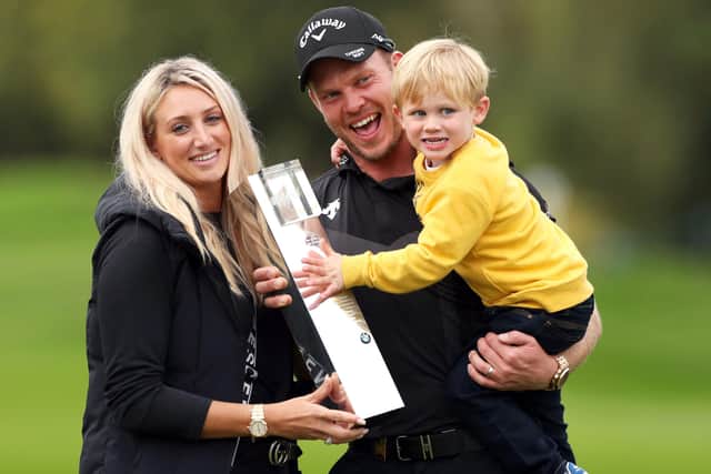 Danny Willett, his wife Nicole and son Zachariah James with the trophy after winning the BMW PGA Championship. Picture: Bradley Collyer/PA Wire.