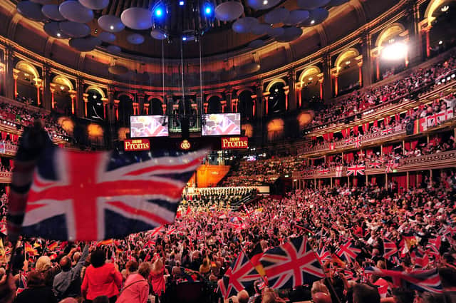 People wave flags at the Royal Albert Hall on September 7, 2013 during the Last Night of the Proms.  (Photo: CARL COURT/AFP/Getty Images)