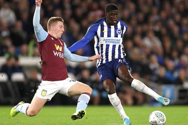 INCOMING: Brighton and Hove Albion's Taylor Richards, right, battles for the ball with Aston Villa's Matt Targett last season. Picture: Andrew Matthews/PA
