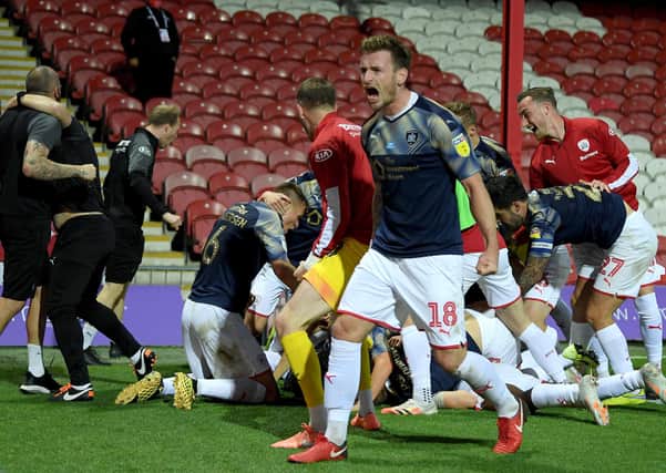 Michael Sollbauer of Barnsley celebrates victory at Brentford last season. (Photo by Mike Hewitt/Getty Images)