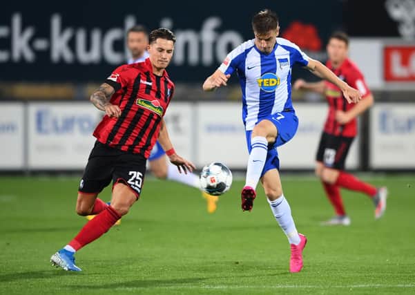 RELAXED: SC Freiburg's Robin Koch, left, challenges Krzysztof Piatek of Hertha Berlin in June of this year. Picture: Matthias Hangst/Getty Images.