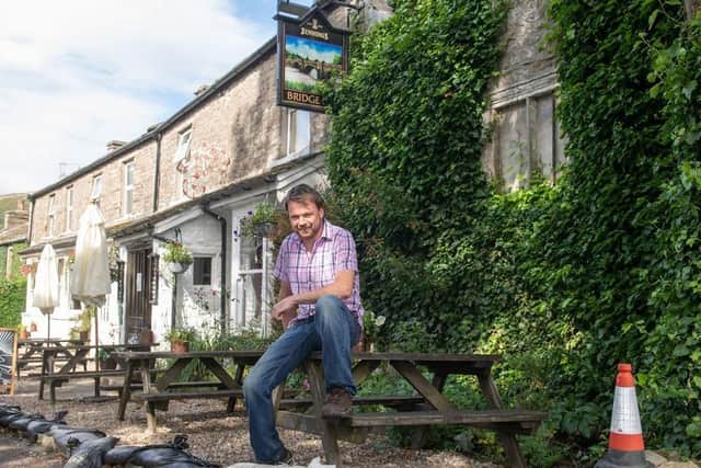 The pub was hit by flash floods last summer and two smaller floods but has re-opened