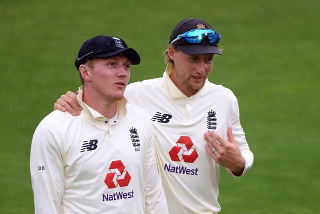 FAMILIAR FACE: EnglandTest captain and future Yorkshire CCC team-mate Joe Root, right, chats with Dom Bess. Picture: Stu Forster/NMC Pool/PA