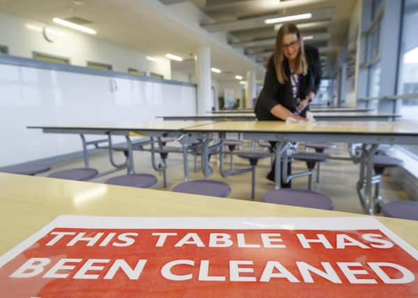 A dinning area is cleaned at Outwood Academy Shafton in Barnsley, South Yorkshire, as preparations are made before the start of the new term.