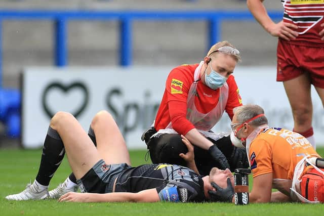 Tigers winger James Clare is treated before being taken from the field on a stretcher. Picture by Mike Egerton/PA Wire.