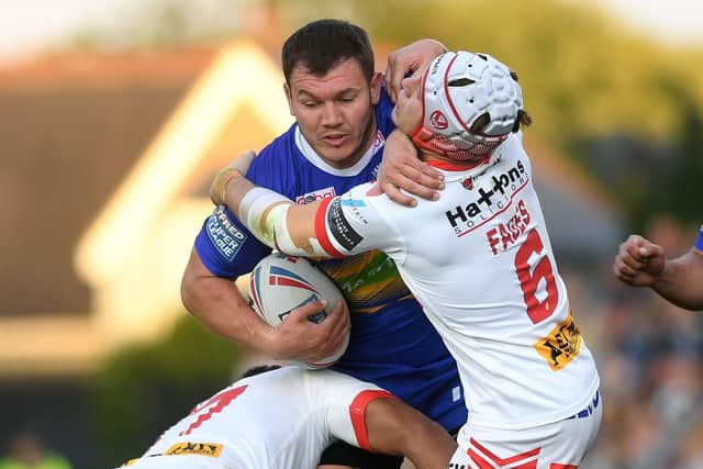 Experienced: Brett Ferres barrels through would-be tacklers for Leeds Rhinos at St Helens last season (Pictures: Jonathan Gawthorpe)