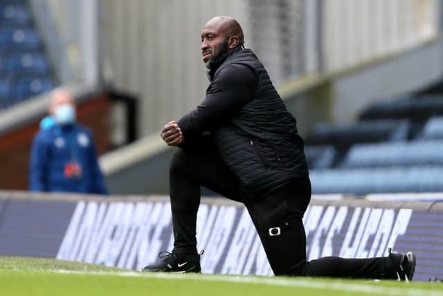 Doncaster Rovers manager Darren Moore takes a knee before the Carabao Cup match at Ewood Park. (Picture: PA)
