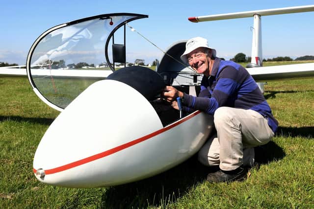Pictured, Jerry Henderson-Newton, the Airfield director at the Yorkshire Gliding Club readies his 1952 Slingsbu T21 2 seater training glider made of wood at the Vintage week at Yorkshire Gliding Club near Killburn. Photo credit: Gary Longbottom/ JPIMediaResell