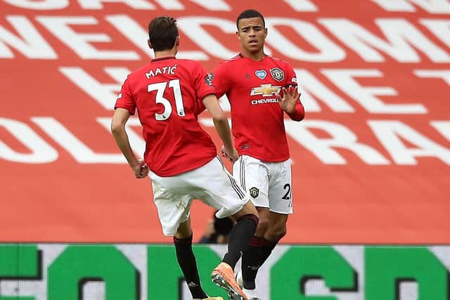 Manchester United's Mason Greenwood (right) celebrates scoring his side's first goal of the game with team-mate Nemanja Matic (Picture: PA)
