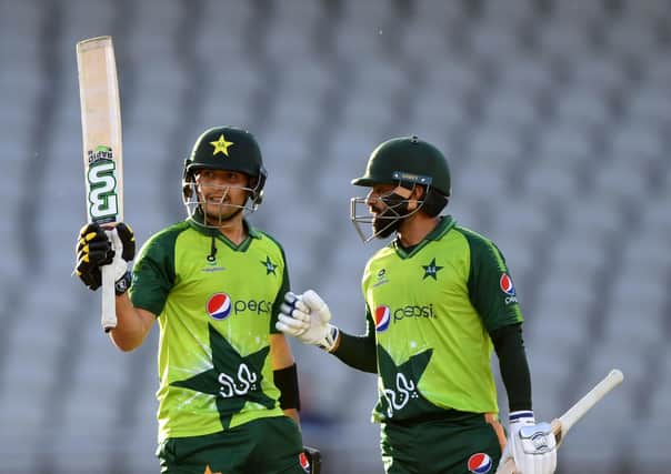 Double act: Pakistan's Haider Ali (left) celebrates his half-century on debut, while Mohammed Hafeez, right, hit 86 not out in the tourists' win. Picture: Mike Hewitt/PA Wire.