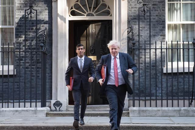 Boris Johnson and Rishi Sunak, the Chancellor, leave Downing Street ahead of this week's Cabinet meeting.