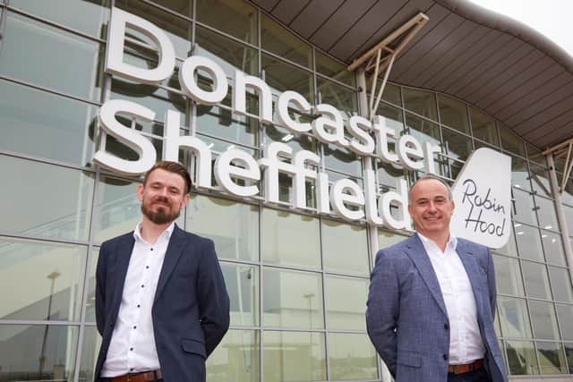 Chris Harcombe Aviation Development Director, DSA and Owain Jones, MD Wizz Air UK in front of the Doncaster Sheffield Airport terminal building.
