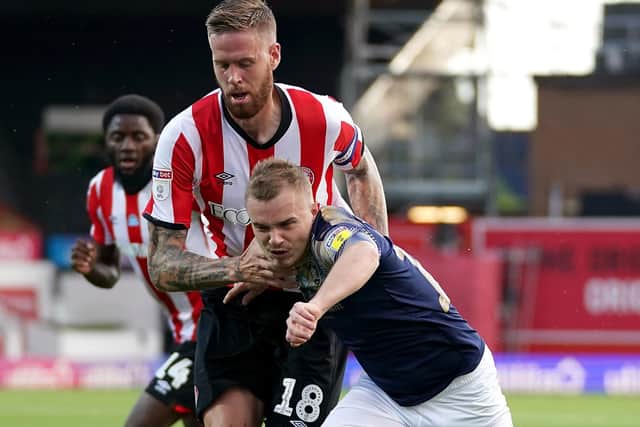 Brentford's Pontus Jansson (left) and Barnsley's Luke Thomas battle for the ball (Picture: PA)