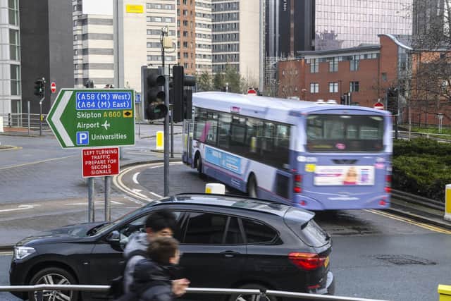 How can pollution and vehicle use be cut in cities like Leeds?