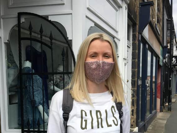 Emily Drew models a Jillian Welch Design face covering outside the Harrogate shop.