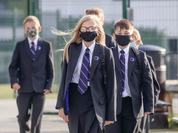 Pupils pictured wearing protective face masks at Outwood Academy Adwick in Doncaster, as schools in England reopen to pupils following the coronavirus lockdown. Photo credit:  Danny Lawson/PA