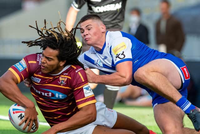 Huddersfield Giants youngster Dom Crosby tries an offload. (PIC: BRUCE ROLLINSON)