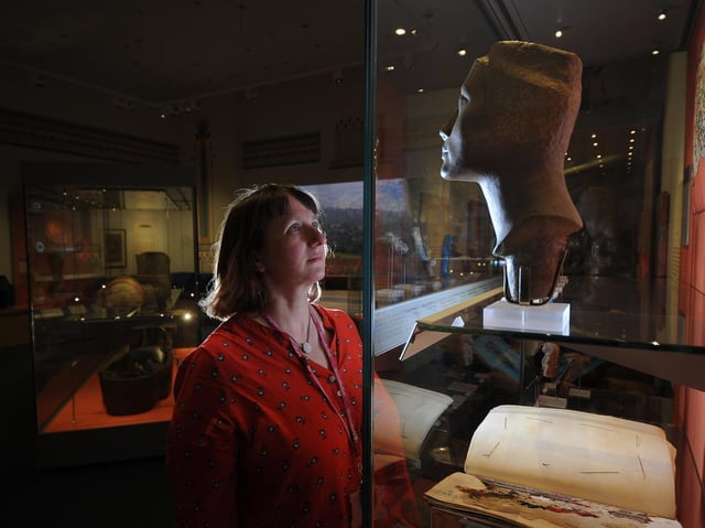 Martha Jasko-Lawrence            takes a close look at some of the ancient exhibits on display            in the new gallery at Weston Park Museum.
