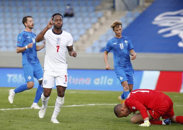 Spot on: England's Raheem Sterling celebrates after his late penalty winner against Iceland. Picture: AP Photo/Brynjar Gunnarson