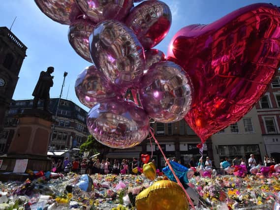 Tributes left in Manchester city centre following the bombing at Manchester Arena in May 2017